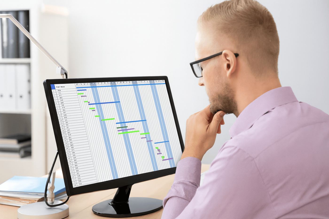 Planner reviewing a project schedule